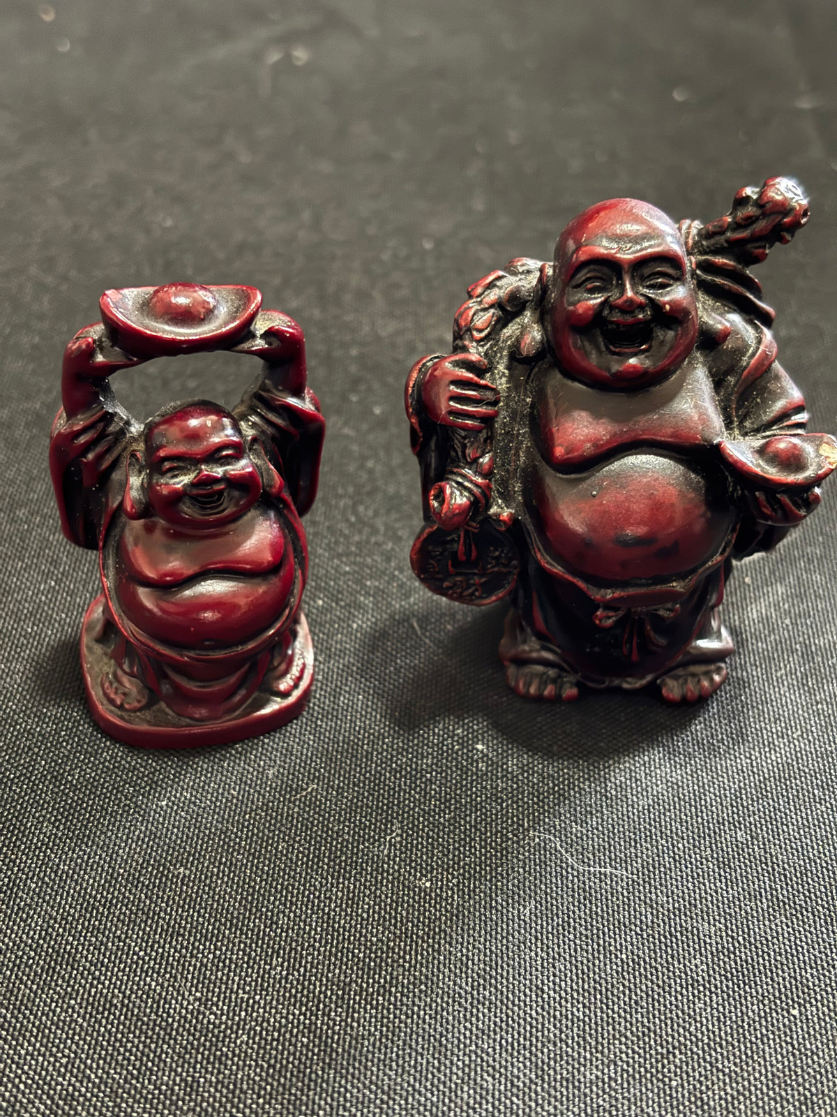 Pair of Miniature Oxblood Red Laughing Buddha Figurines